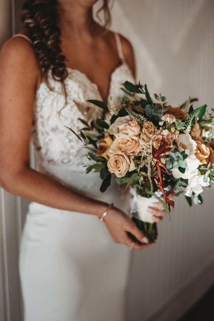 detail shot of bride holding her blush floral wedding bouquet captured by Maryland wedding photographer