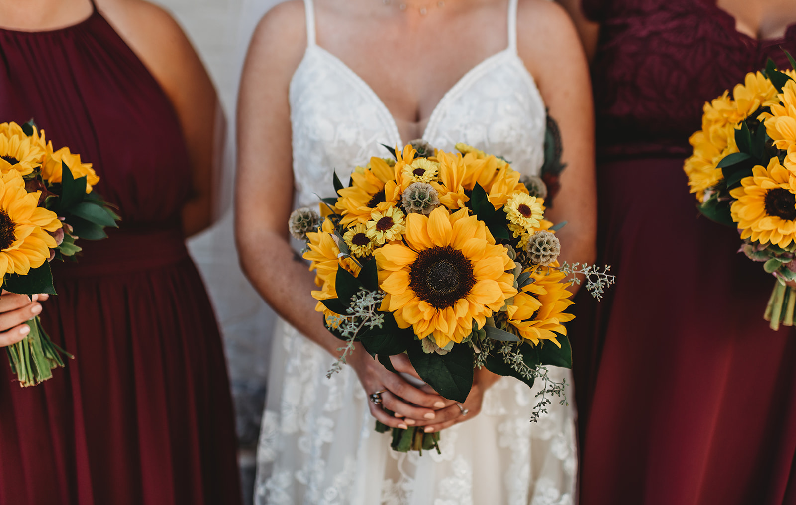 bride holding a sunflower bouquet for her Baltimore wedding with Baltimore wedding photographers