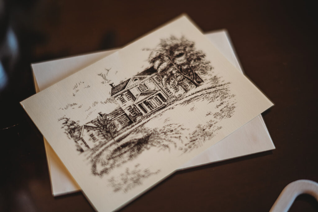 Baltimore wedding photos with wedding invitation with a sketch of the Baltimore wedding venues on one side 