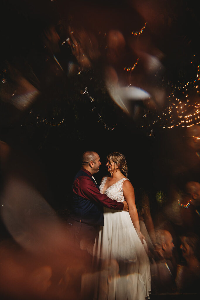 Maryland wedding photographer captures overhills mansion wedding last dance between bride and groom the night of their wedding