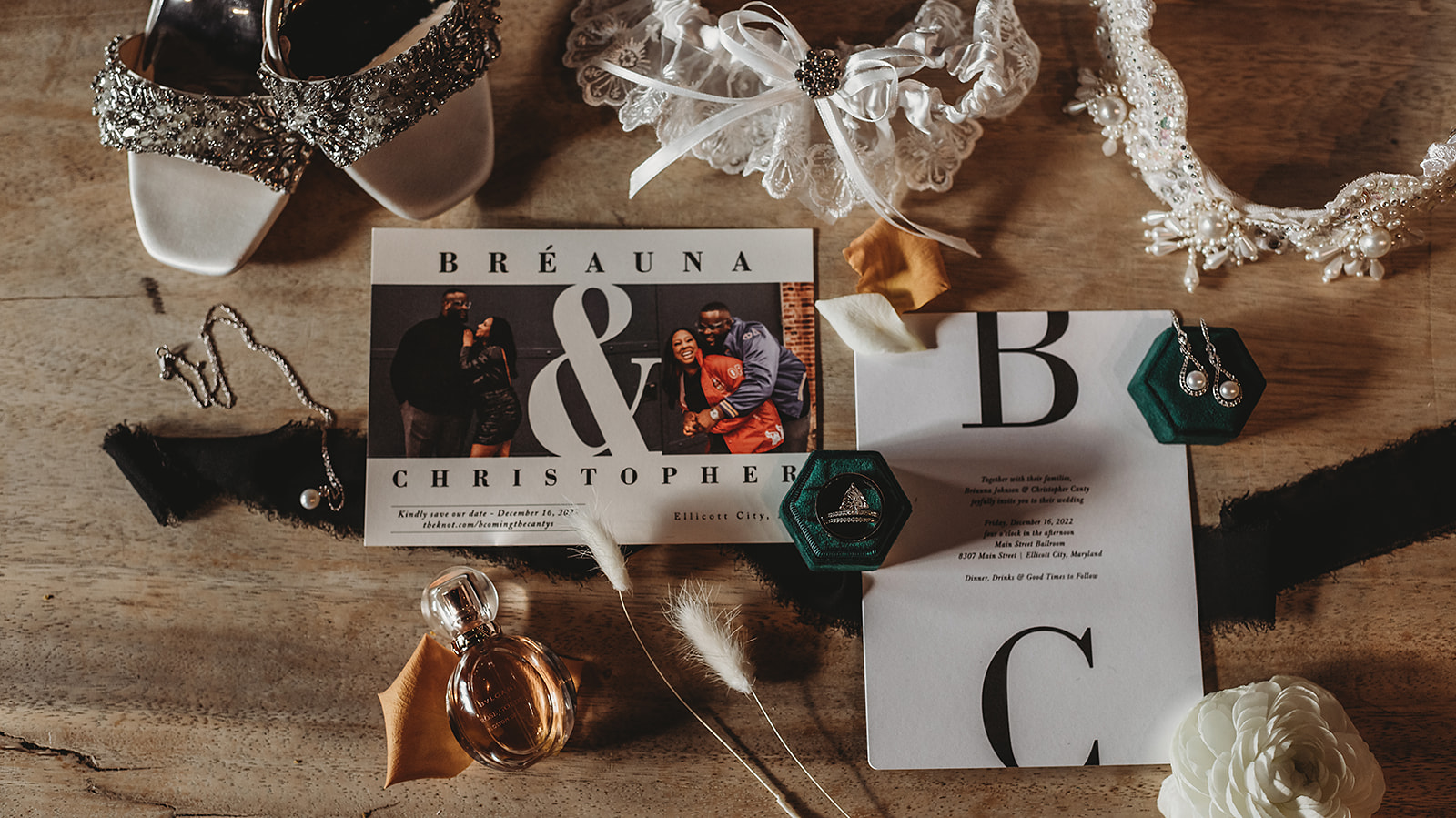 Baltimore wedding photographers captures wedding invitations laid out with other small details from the bride and groom