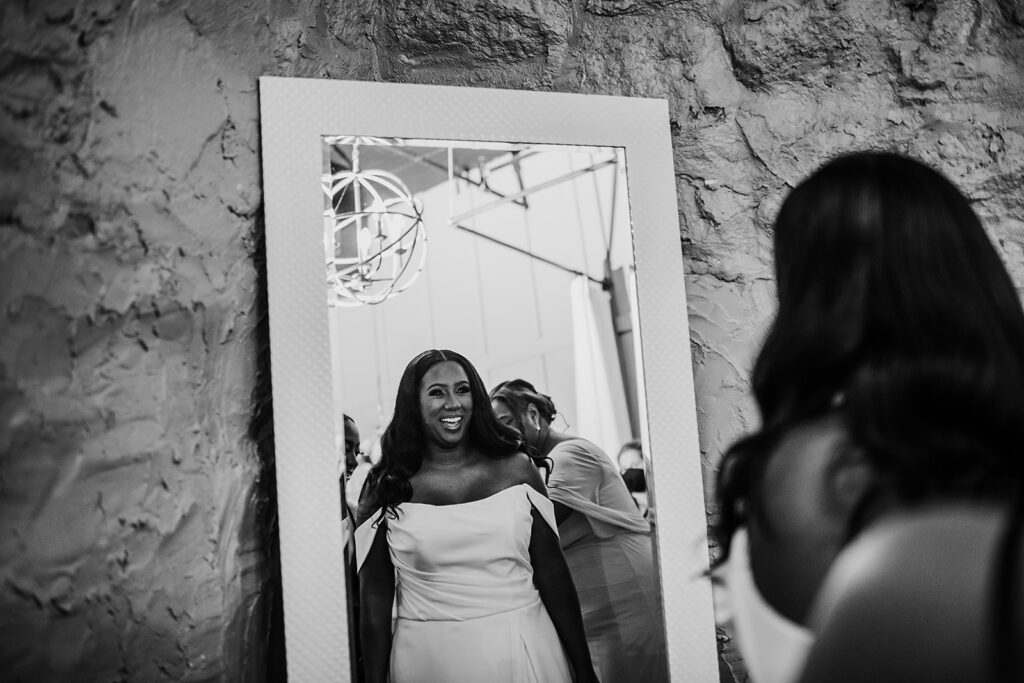 bride getting ready in her bridal suite with her family and bridesmaids at her industrial Baltimore wedding venue with Baltimore photographers