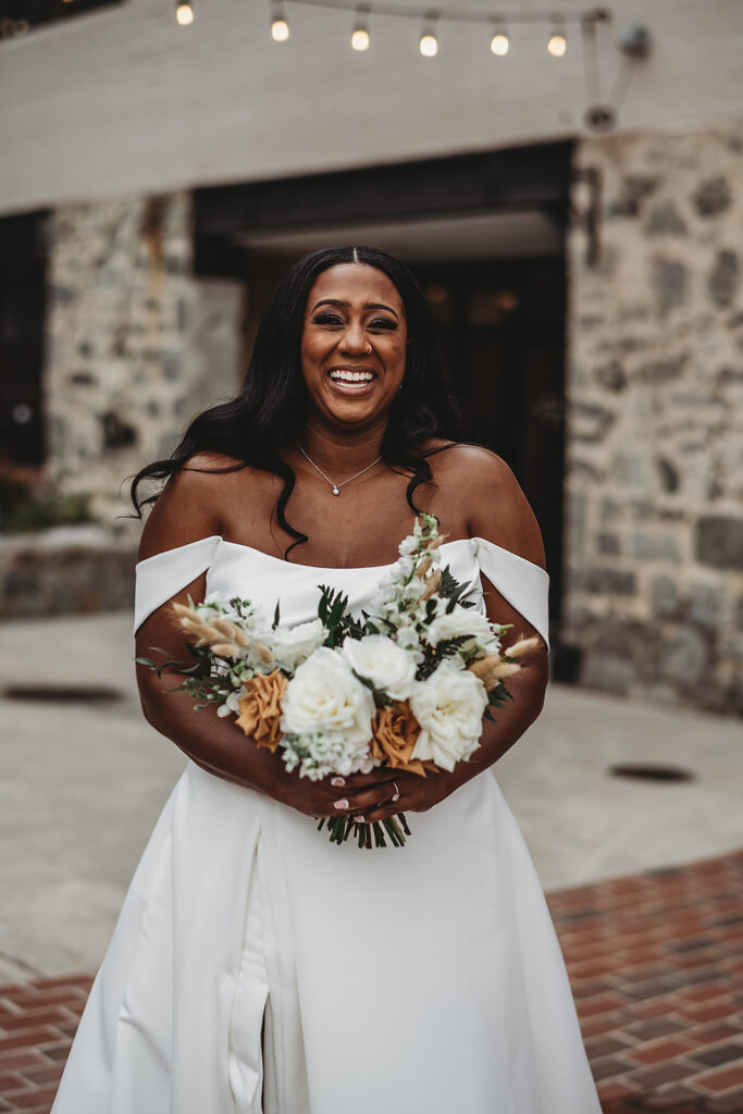 Baltimore wedding photographers capture bride laughing in wedding dress