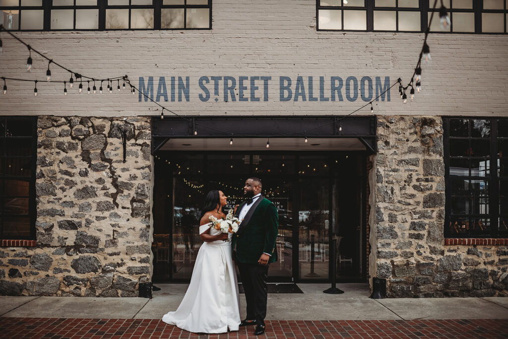Baltimore wedding photographers capture bride and groom outside wedding venue
