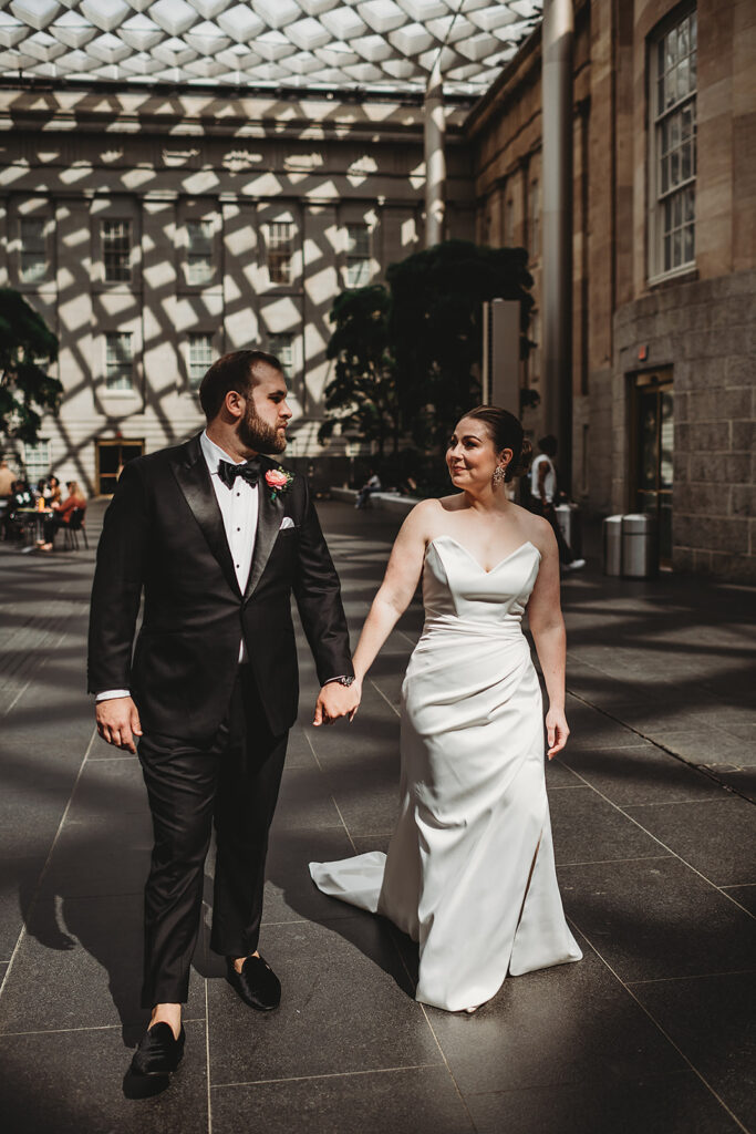 Baltimore wedding photographers capture bride and groom walking together