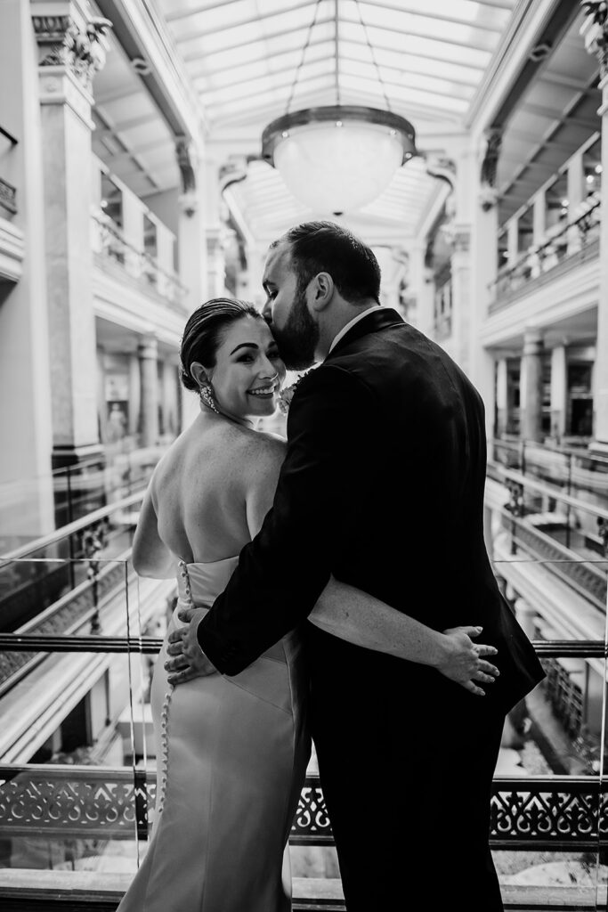 Baltimore wedding photographers capture bride looking over shoulder after Riggs Hotel DC wedding