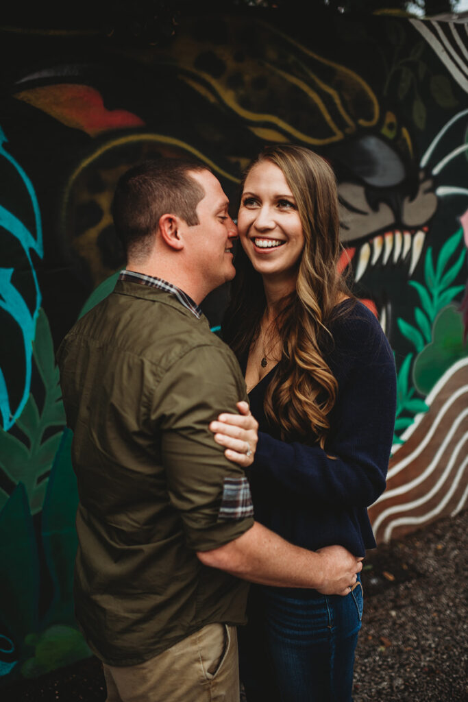 Baltimore wedding photographers capture man kissing woman's cheek and making her laugh
