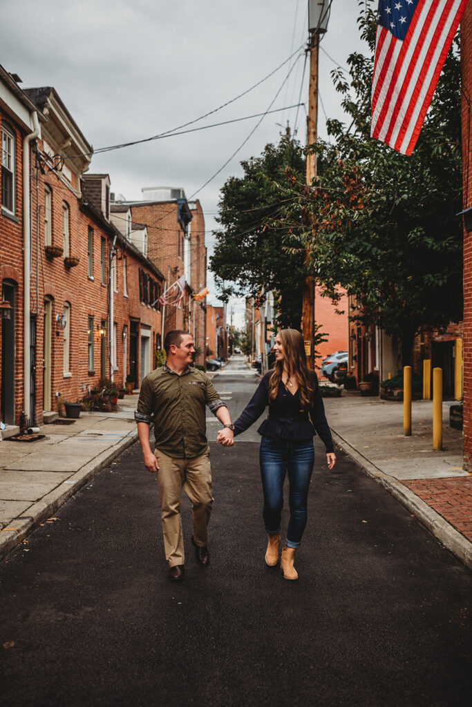 Baltimore wedding photographers capture couple walking down street