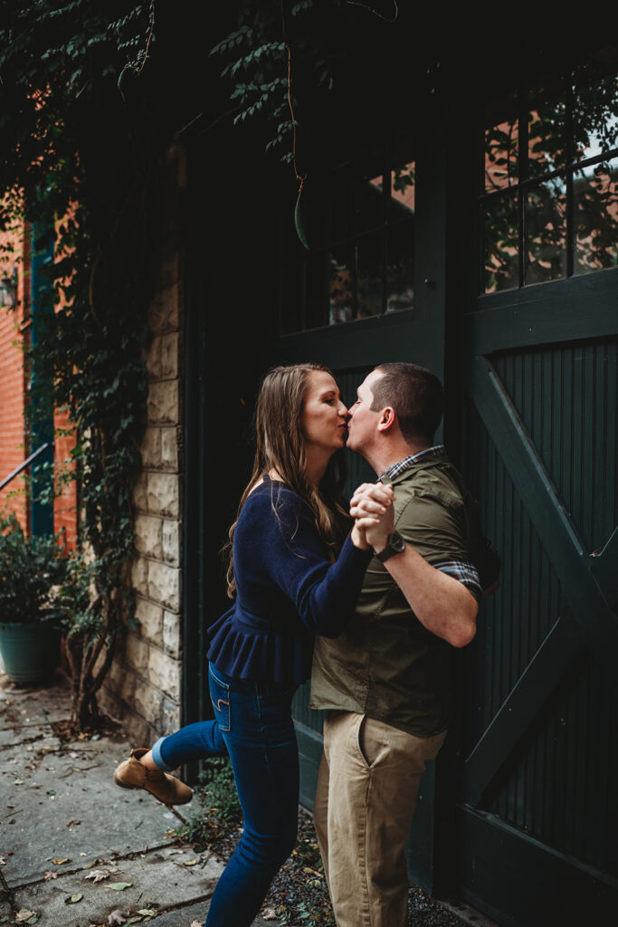 Baltimore wedding photographers capture couple kissing in the alley way