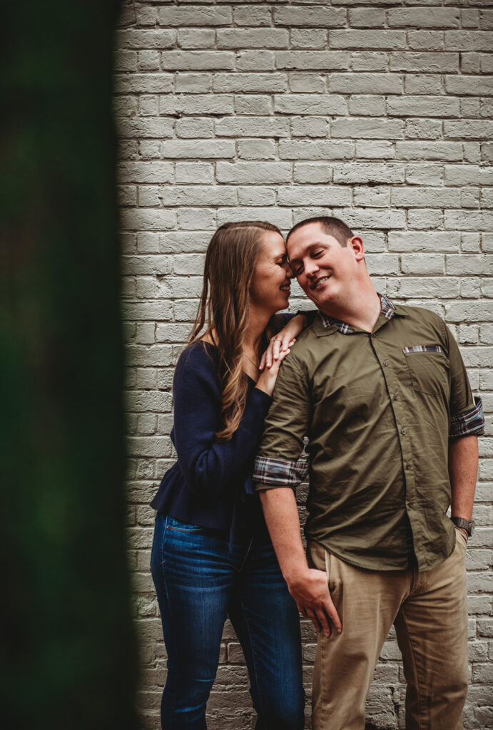 Baltimore wedding photographers capture woman kissing man's cheek during photos
