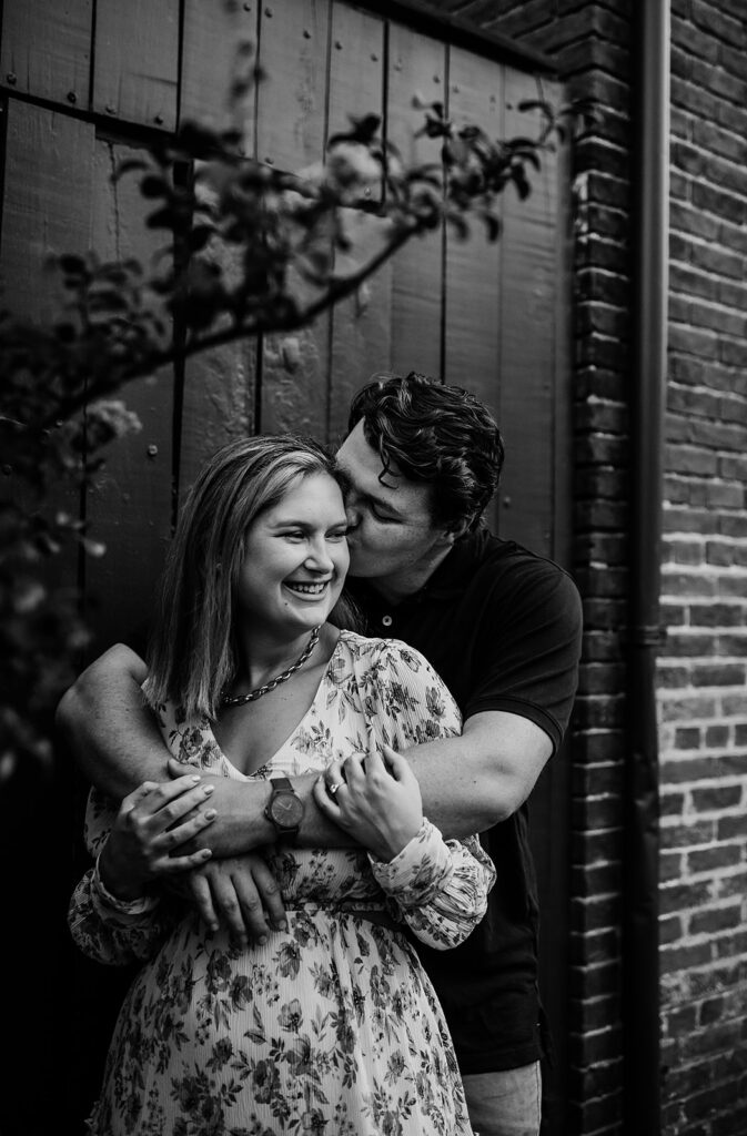 Baltimore wedding photographers capture black and white portrait of couple hugging