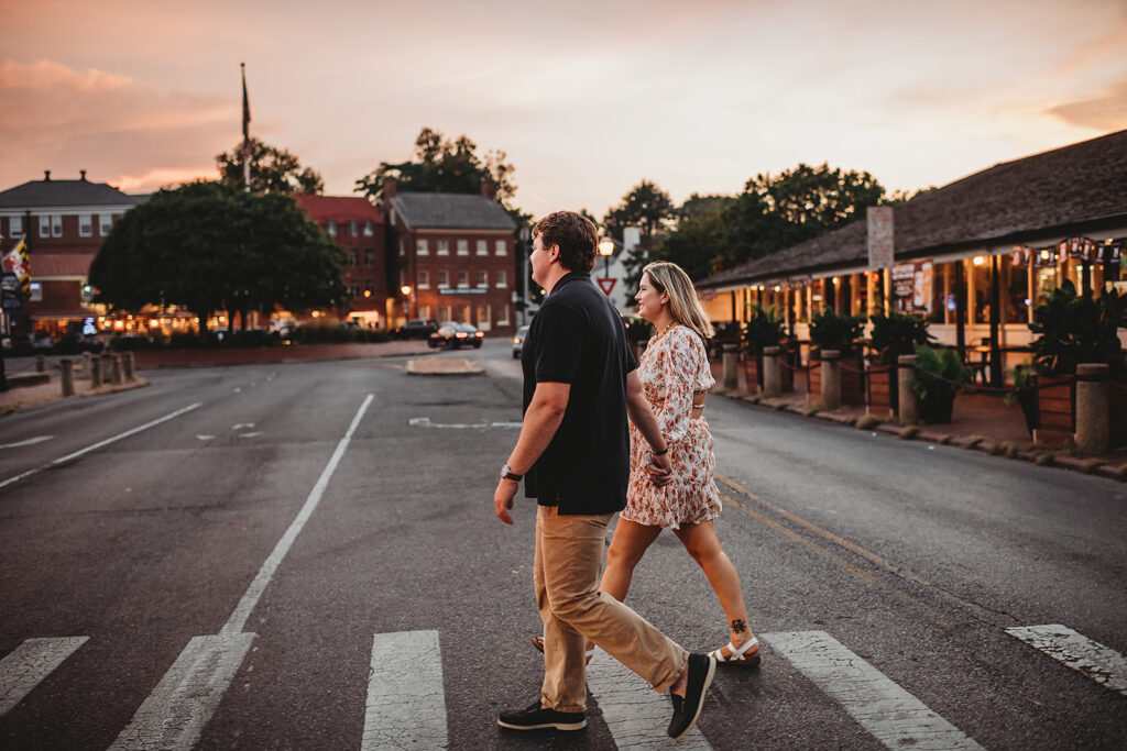 Baltimore wedding photographers capture couple holding hands and walking across the street