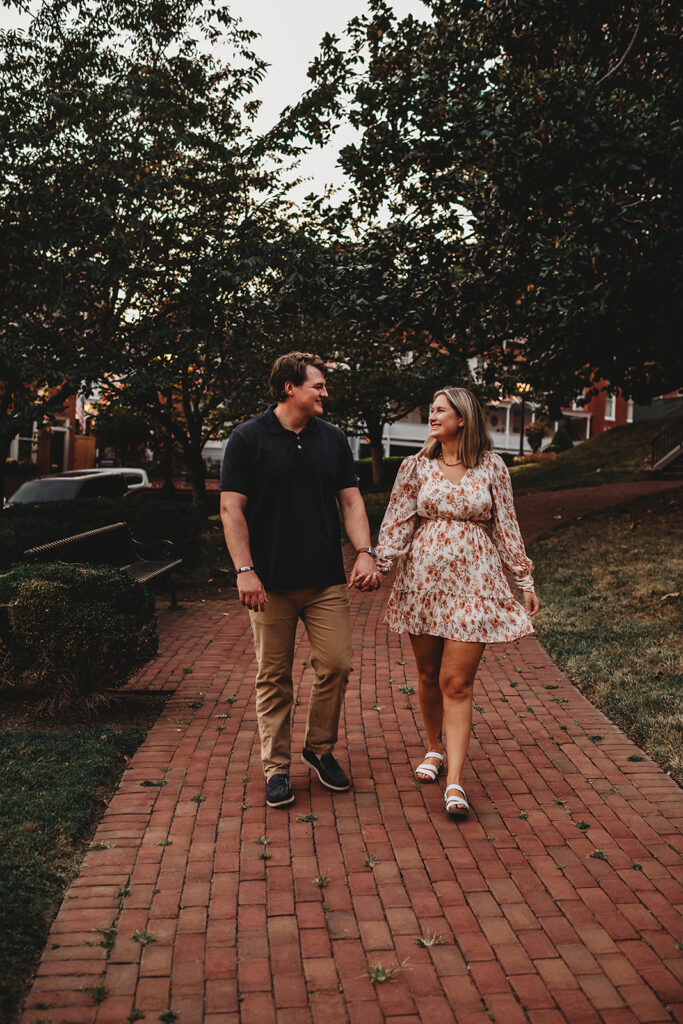 Baltimore wedding photographers capture couple holding hands and walking together