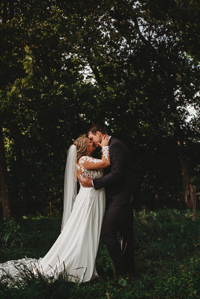 Maryland wedding photographer captures couple kissing in forest