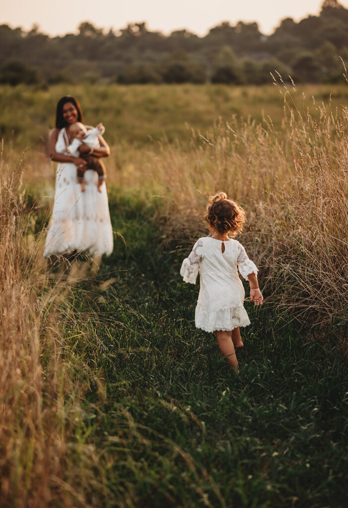 Baltimore photographer captures mother running after young children in field