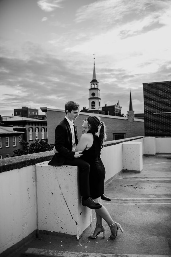 Maryland engagement photographers capture black and white portrait of man and woman on roof