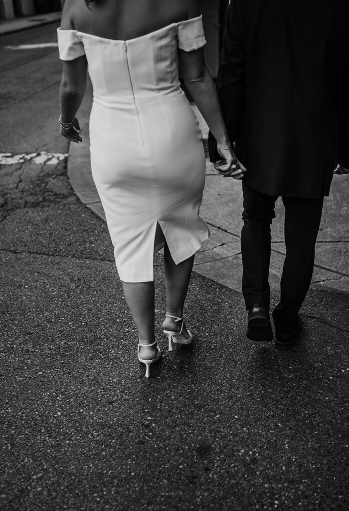 Baltimore wedding photographer captures newly engaged couple walking hand in hand