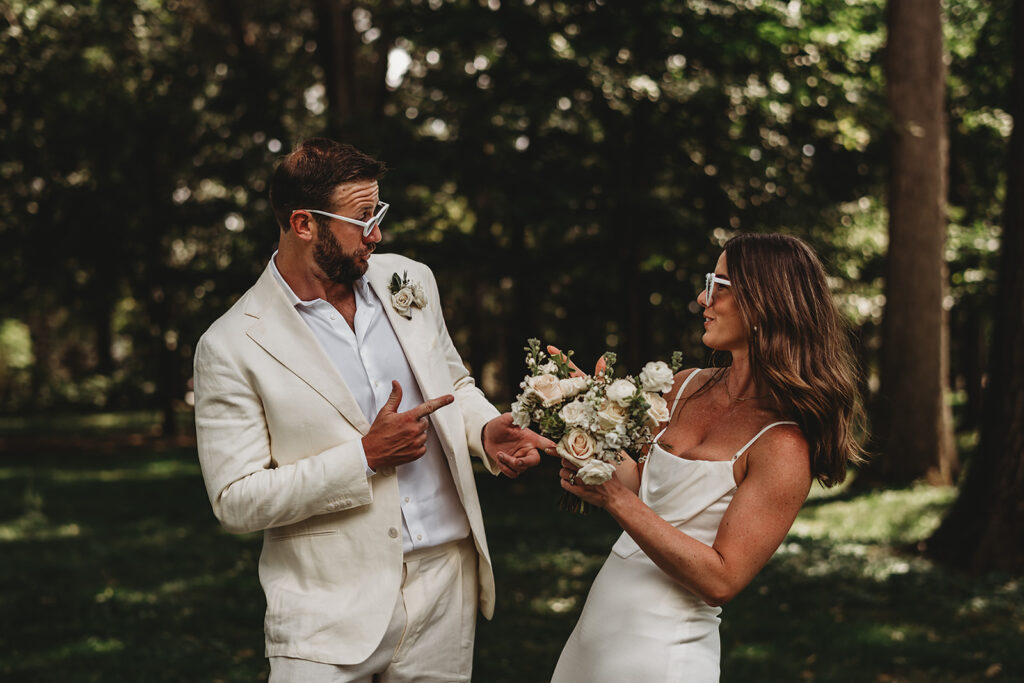 Maryland wedding photographer captures bride and groom wearing sunglasses and shooting finger guns during bridal portraits
