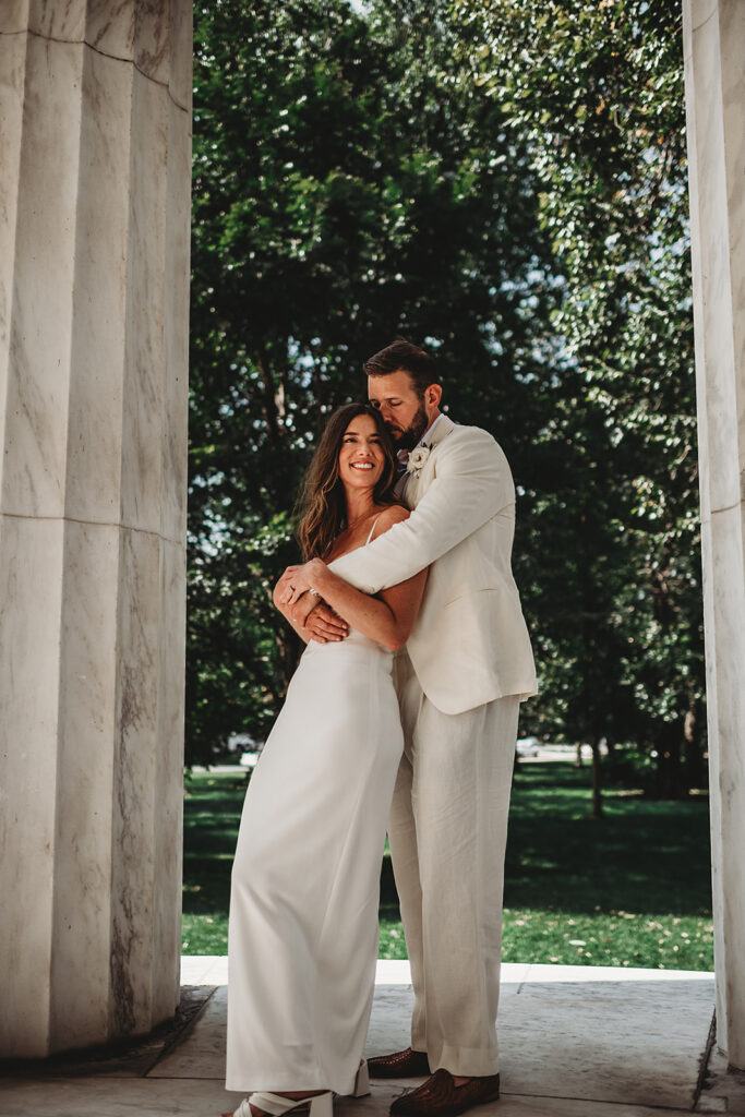 Baltimore wedding photographer captures outdoor bridal portraits of bride and groom hugging