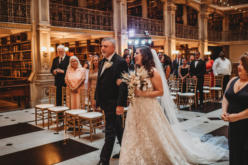 Baltimore wedding photographer captures bride walking down aisle with father