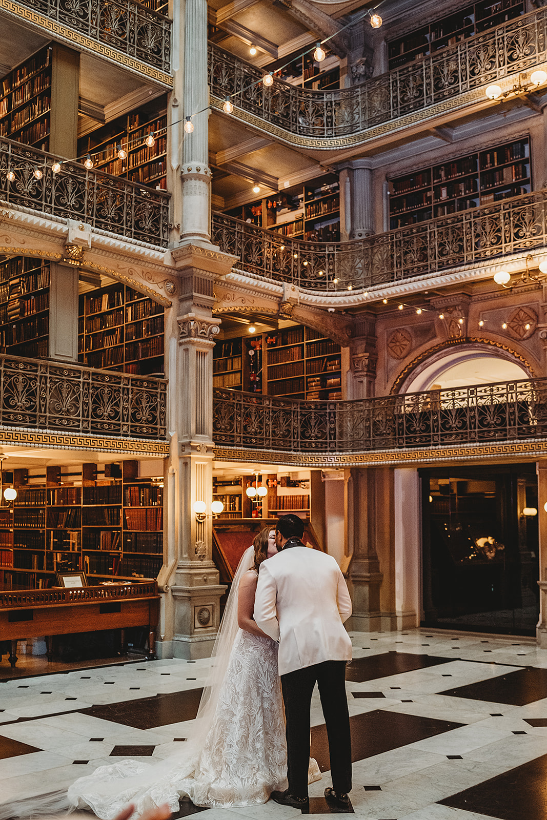 Bride and groom at the Peabody library in Baltimore for their wedding with Baltimore wedding photographers