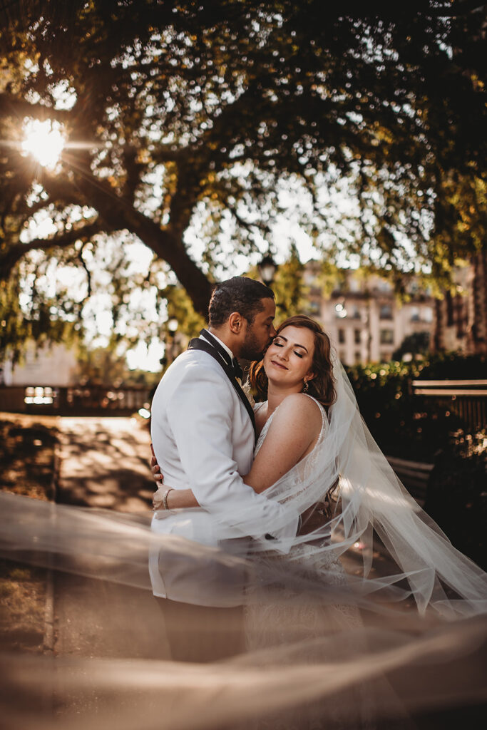 Baltimore wedding photographer captures couple embracing during golden hour bridal portraits