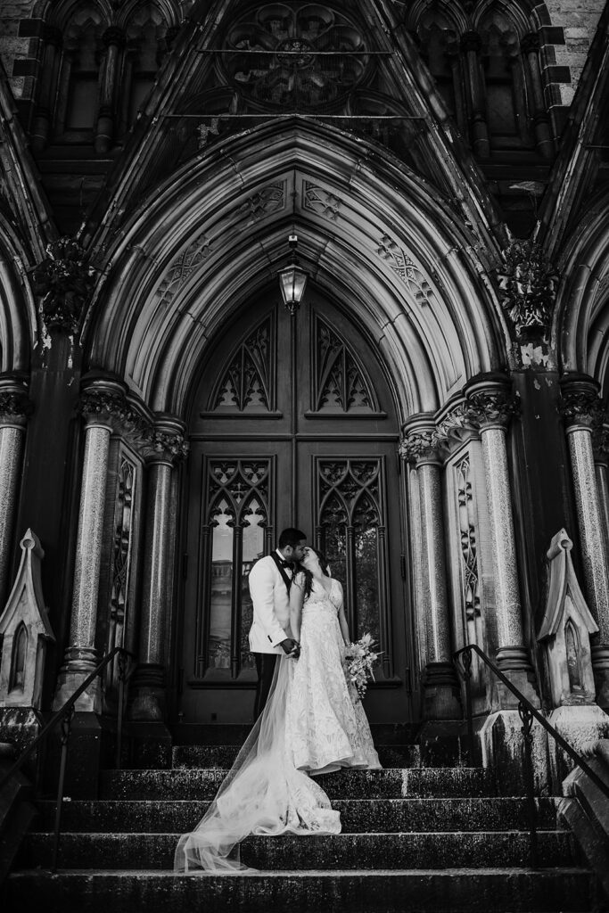 Baltimore wedding photographers capture bride and groom standing in chapel