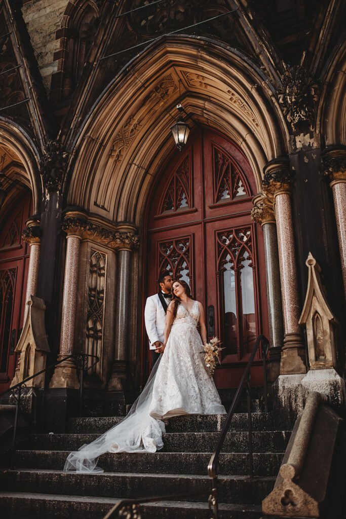 Baltimore wedding photographer captures couple standing together wearing wedding attire