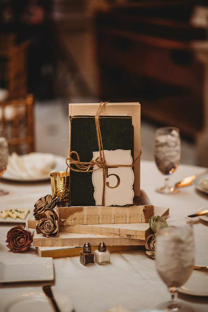 Baltimore wedding photographer captures table centerpieces of books wrapped in twine