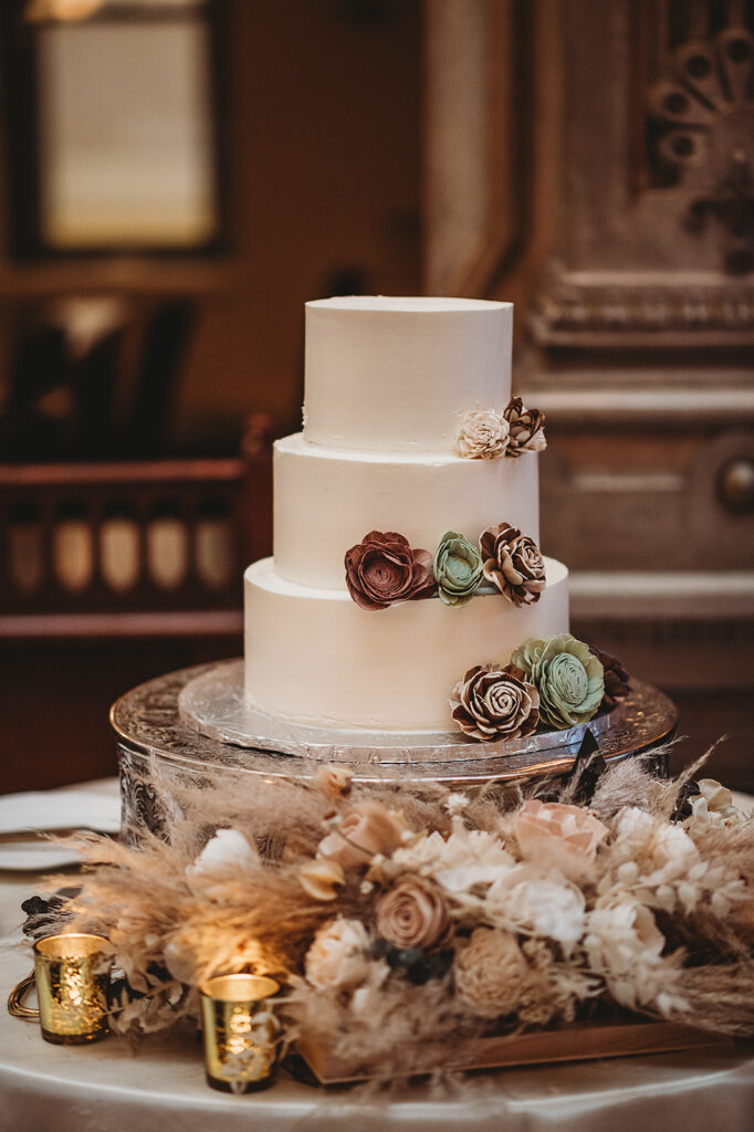 Baltimore wedding photographer captures three tiered wedding cake with succulents 
