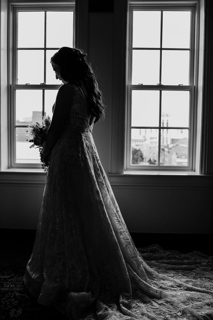 Baltimore wedding photographer captures bride wearing wedding dress in black and white portrait