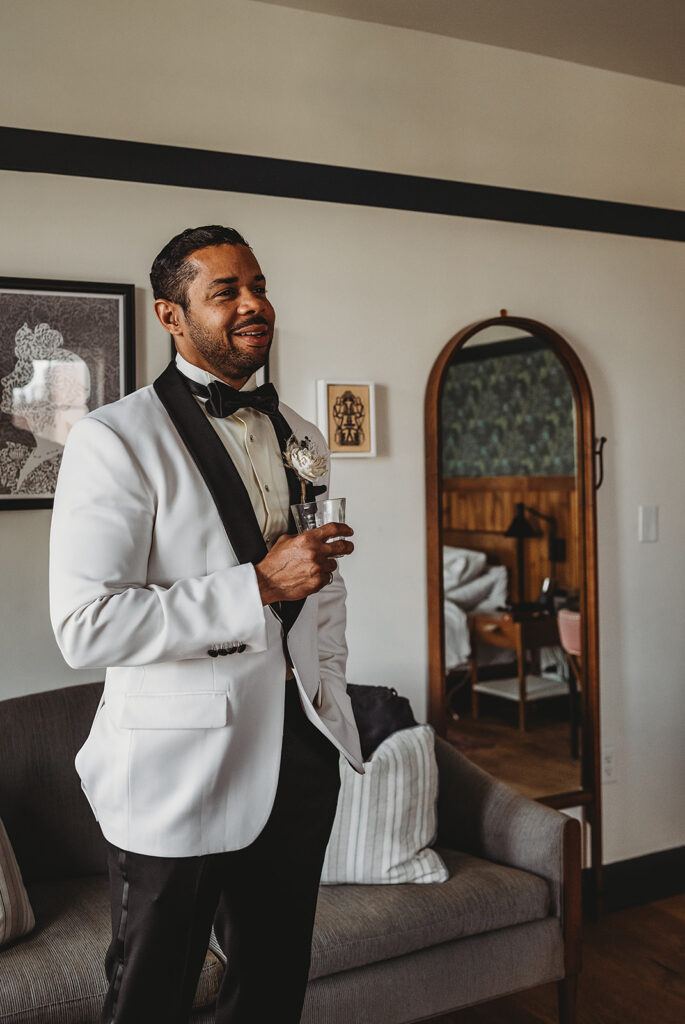 Baltimore wedding photographer captures groom holding drink