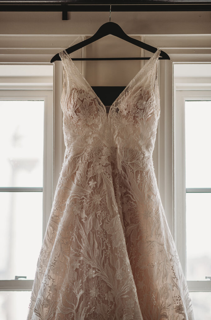 Baltimore wedding photographer captures wedding dress hanging for detail shots