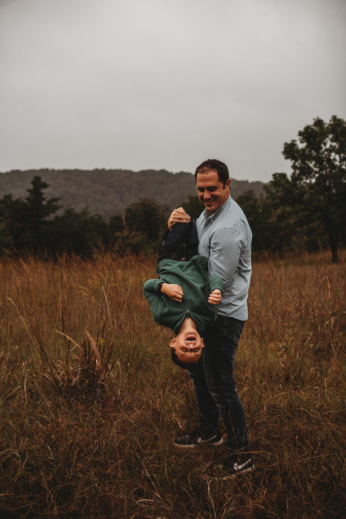 Baltimore photographers capture dad playing with boy during family photos