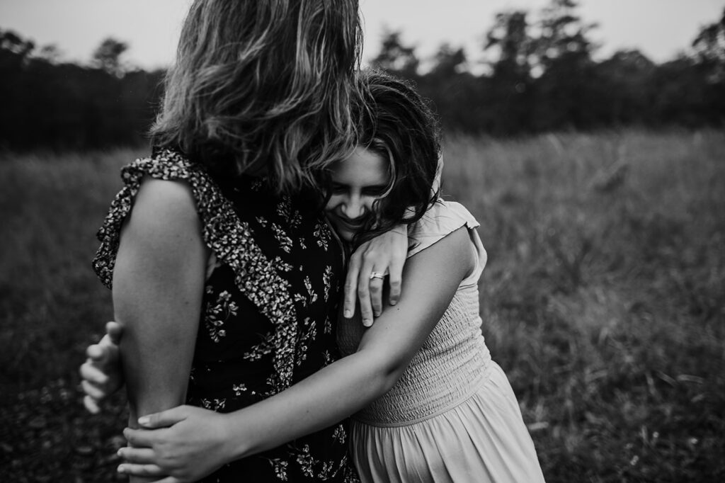 Baltimore photographers capture daughter hugging mother during family photos