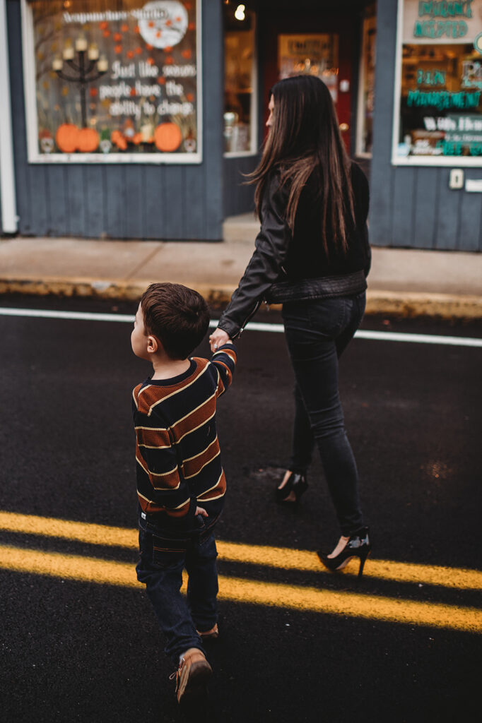 Baltimore photographers capture mother holding son's hand while walking across street