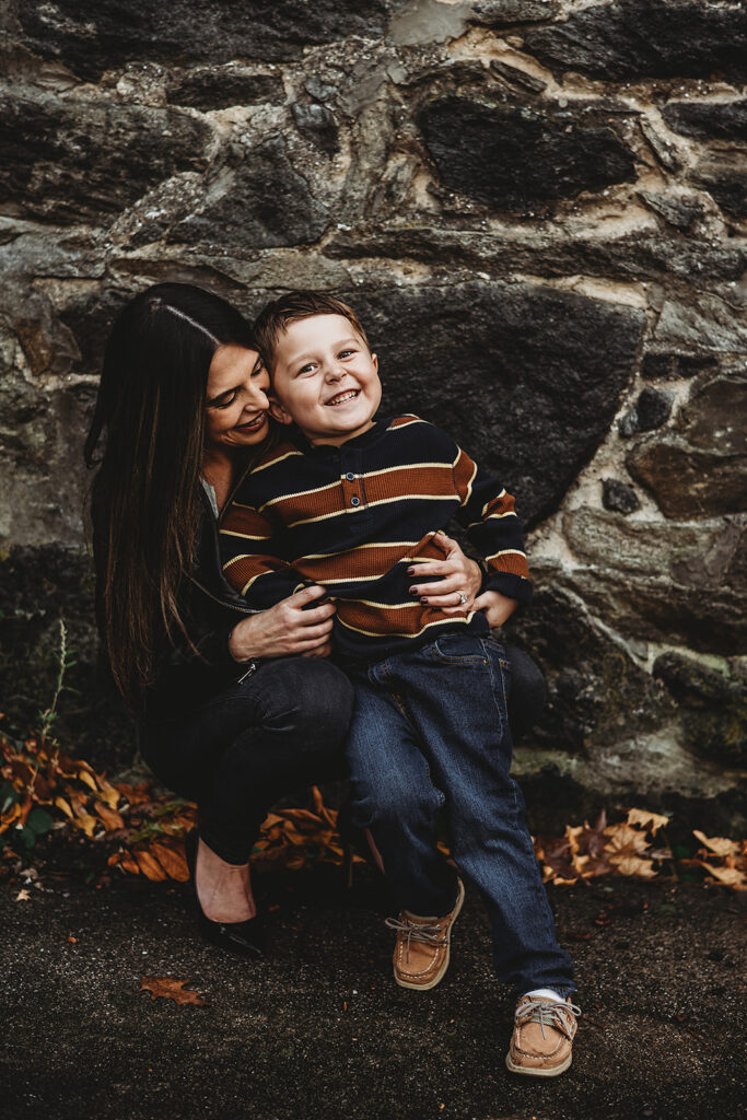 Baltimore photographers capture mother and son playing together during outdoor family portraits