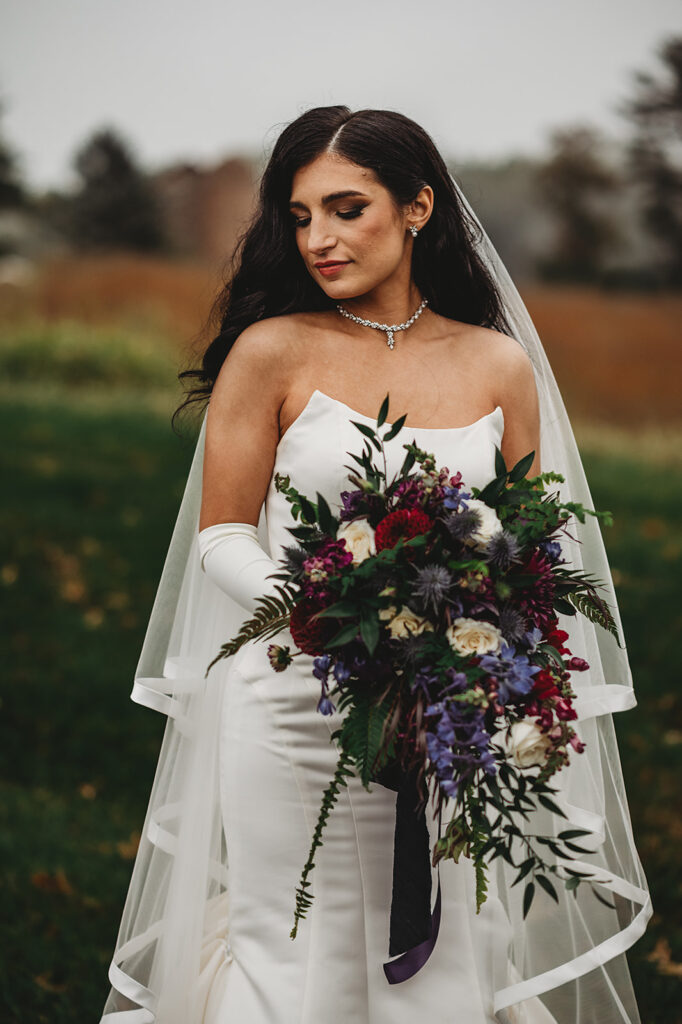 Baltimore wedding photographer captures bride holding bridal bouquet on Baltimore wedding day