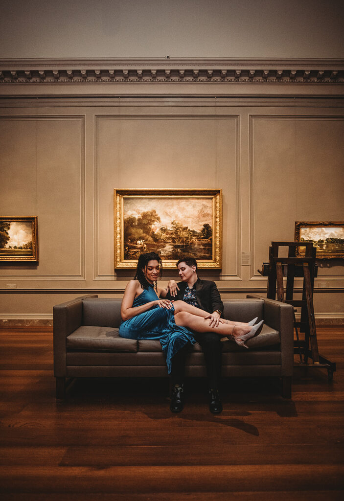 Maryland engagement photographer captures couple sitting on couch cuddling during washington dc engagement photos