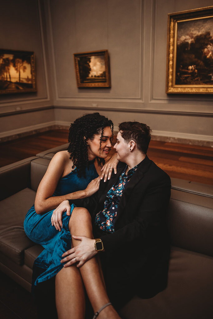 Maryland engagement photographer captures couple cuddling on couch in Washington DC engagement photos