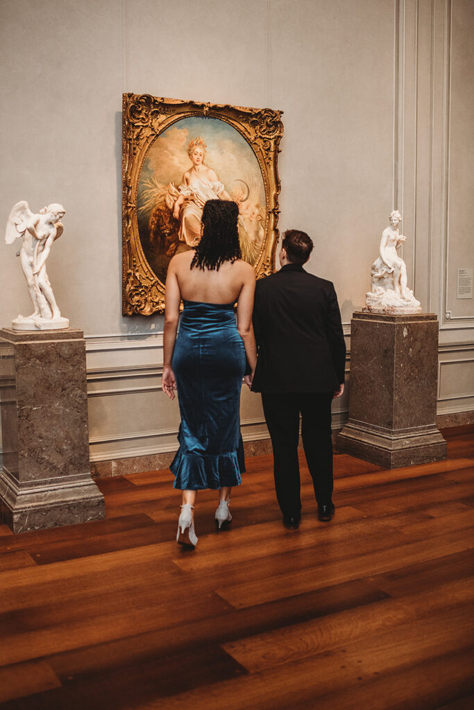 Maryland engagement photographer captures couple looking at art in art museum 