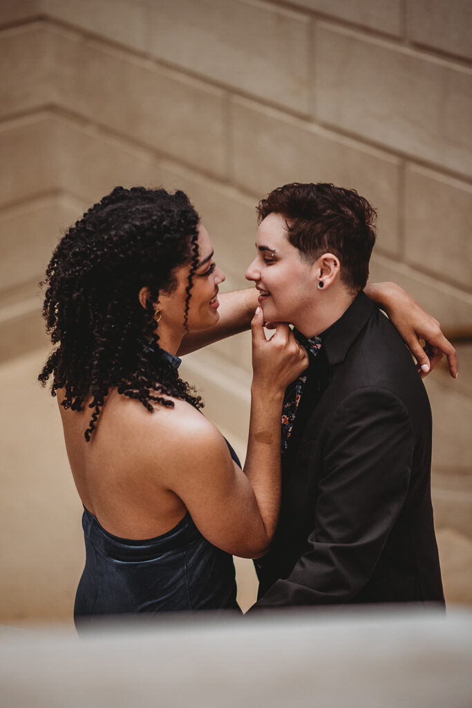 Maryland engagement photographer captures woman hugging fiance and touching their chin