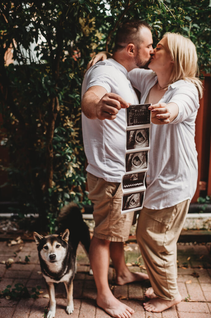 Baltimore photographers capture couple holding ultrasound pictures