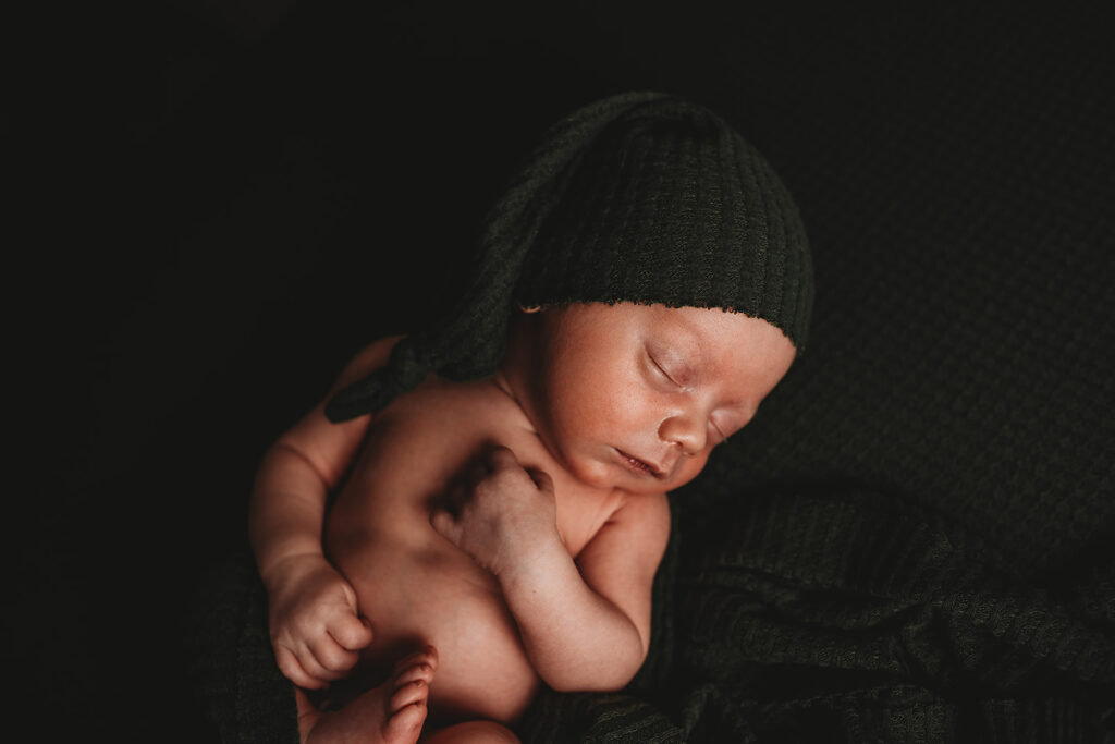 Baltimore photographers capture baby sleeping wearing black hat