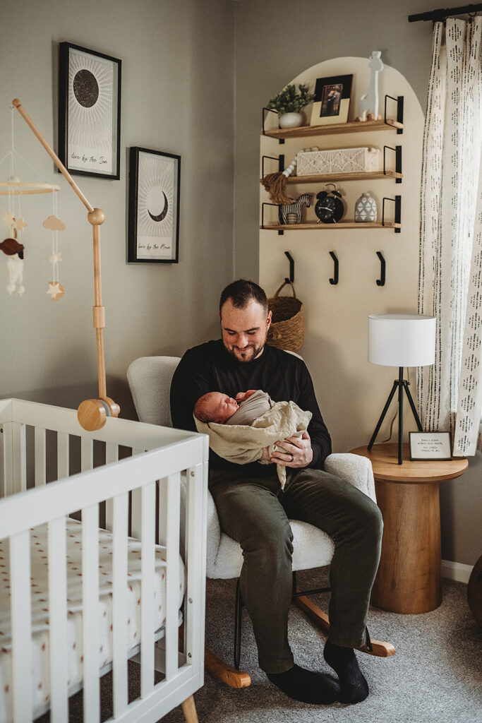 Baltimore photographers capture father rocking baby in rocking chair