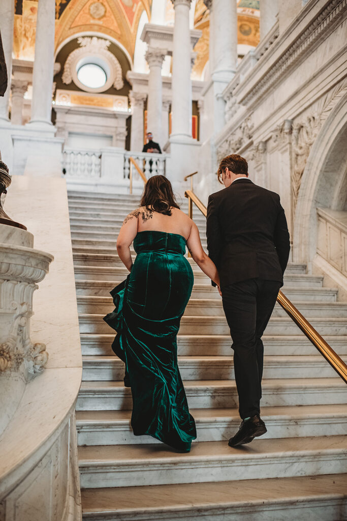 Baltimore wedding photographer captures bride and groom walking upstairs in Library of Congress