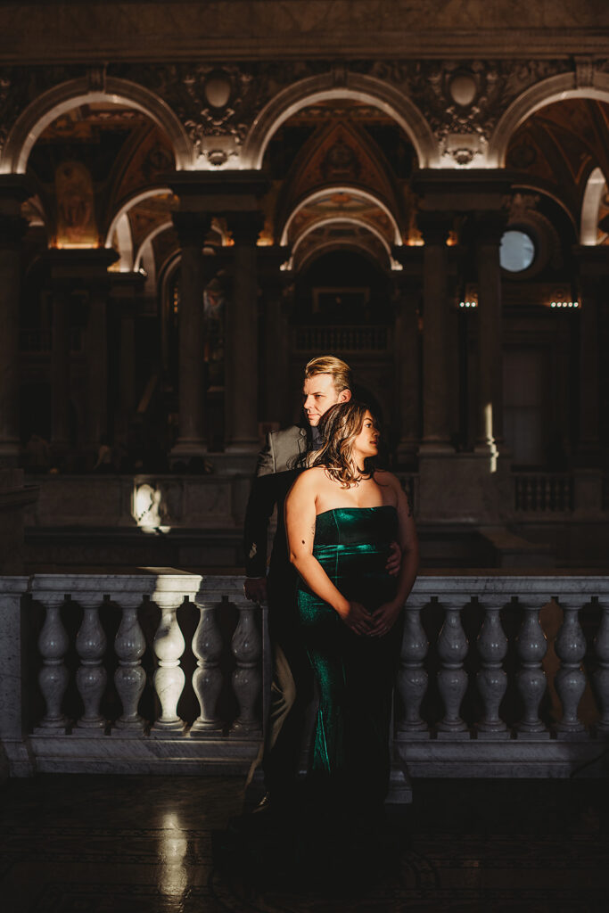 Baltimore wedding photographer captures couple standing together against railing