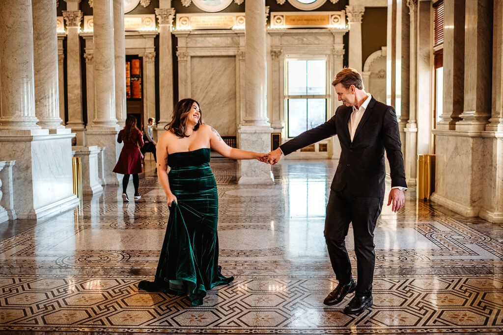 Baltimore wedding photographer captures couple holding hands while walking through Library of Congress