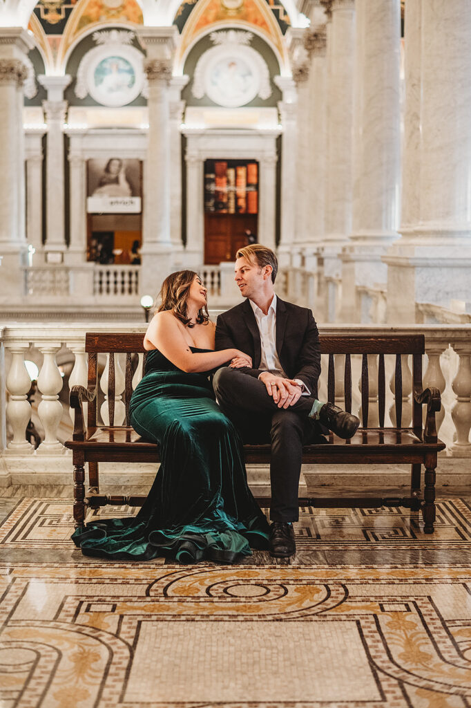 Baltimore wedding photographer captures couple sitting on bench together during Library of Congress wedding photos