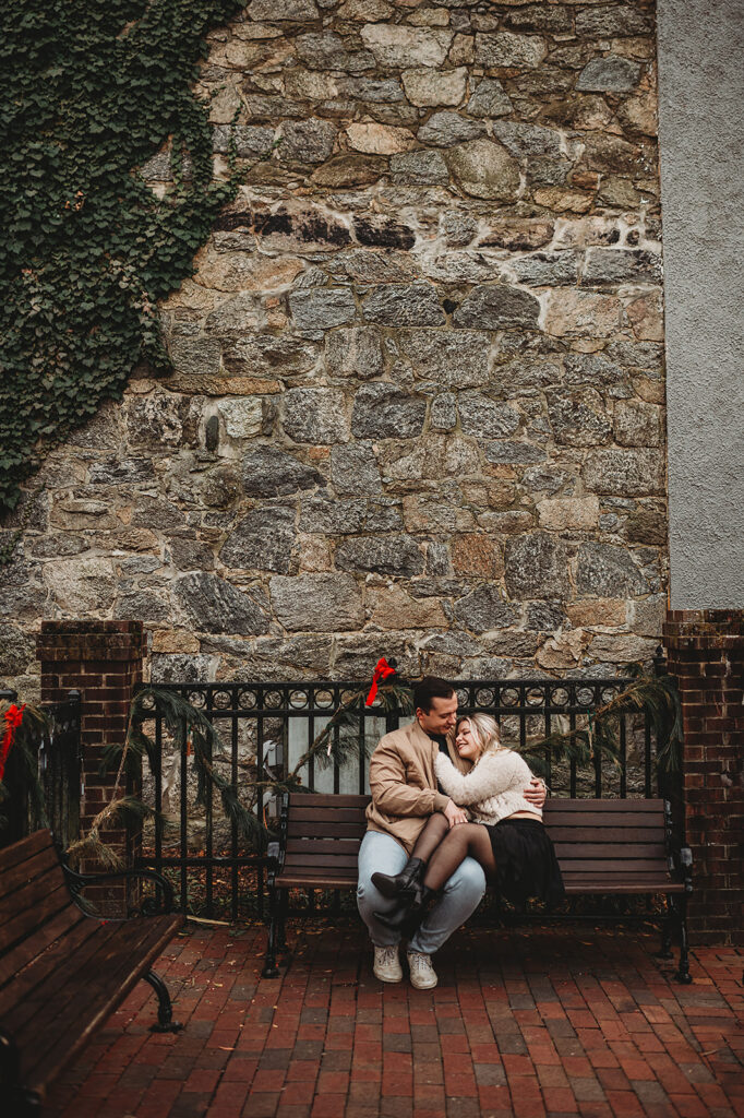 Maryland wedding photographer captures couple sitting on bench